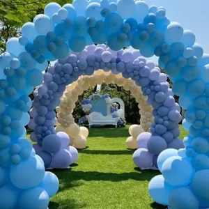 Birthday balloon decoration with pastel blue, lavender and yellow arch tunnel outdoors in Indore