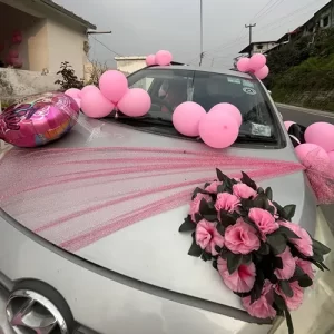 Pink balloons and pink carnation flower bouquet car decoration on silver car in Indore