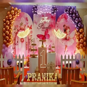 Fairy princess first birthday theme decoration with pink purple balloon arch fairy backdrop and gold balloons Indore