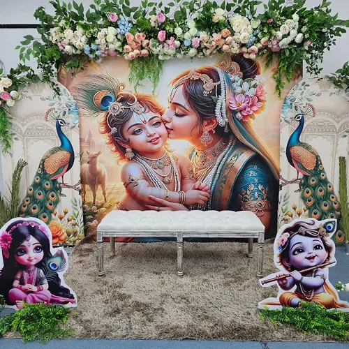 Radha Krishna baby shower peacock decoration with floral arch frame and Krishna cutout standees in Indore