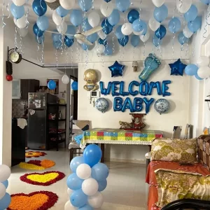 Welcome baby blue foil balloon room decoration with ceiling balloons and flower petal hearts in Indore